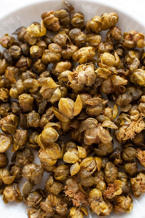 Crispy, nutty, and briny, Fried Capers are magical little flavor bombs that add an incredible dimension of flavor and texture to salads, pasta, meat, and vegetable dishes. #garnish #italian #recipe #easy #quick #flavor #fried #whatare #howtouse Crispy Capers, Sauteed Fish, Pasta Fish, Caper Berries, Fried Capers, Capers Recipe, Food Planning, Salads Pasta, Weekend Food