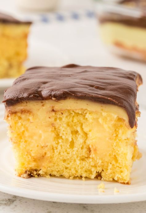 A slice of the poke cake Boston Cream Poke Cake Recipe, Best Poke Cake Recipes, Easy Poke Cake Recipes, Best Poke Cake, Easy Poke Cake, Boston Cream Poke Cake, Cream Poke Cake, Easy Chocolate Ganache, Poke Cake Recipe