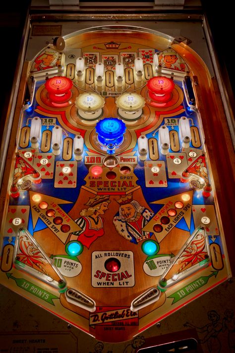 Gottlieb Sweet Hearts with colored bulbs in red and blue pop bumpers. This was Gottlieb's final release to incorporate a playfield outhole, and good riddance. For my money, one of the loveliest designs from Roy Parker's later period. Thanks, Roy. Pinball Art, Sweet Hearts, Good Riddance, My Money, Vintage Games, Pinball Machine, American Art, All Art, Game Design