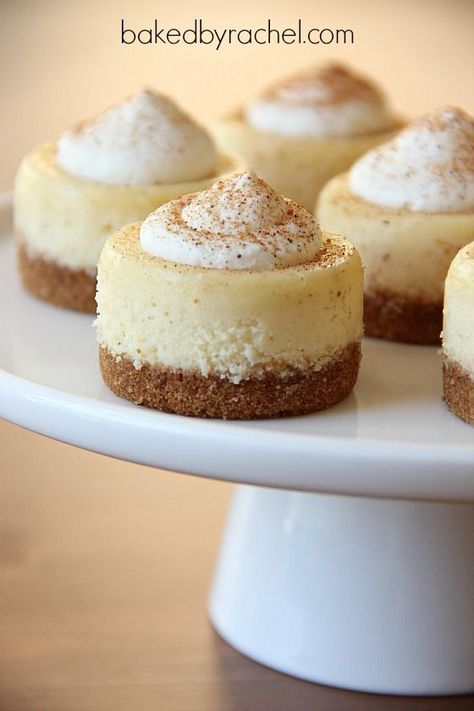 Decadent cheesecake gets a holiday makeover as Mini Eggnog Cheesecakes | Baked By Rachel Mini Eggnog Cheesecake, Eggnog Cheesecake Recipe, Jul Kaka, Biscotti Cheesecake, Easy Dessert Recipes Christmas, Eggnog Cheesecake, Christmas Desserts Easy, Eggnog Recipe, Christmas Food Desserts