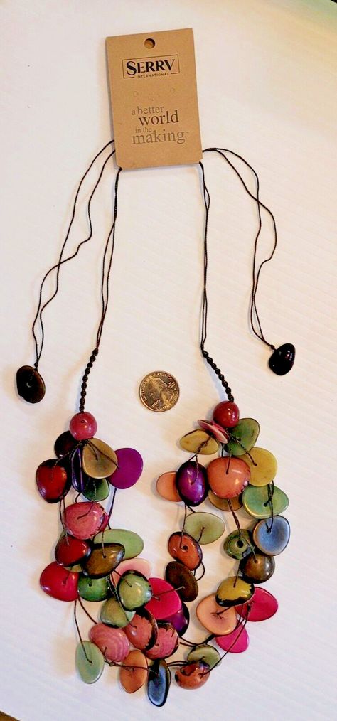 Tagua Necklace Fun and fair! Natural tagua is carved and dyed by artisans into beads for this 6-strand necklace, then strung on an adjustable cotton cord. Each cord ends in a tagua nut, as well. Color and shape may vary. Approximate fully extended length - 18". Your purchase helps rural artisans in Ecuador receive fair wages with access to international fair-trade markets. Since 1980, SERRV International has partnered with artisans in Ecuador, providing a long-term trading partnership and interest-free advance payment for our orders. Through sales of their products, more than 500 artisans and farmers in 18 of Ecuador's 24 provinces receive access to financing and business training in addition to preserving traditional crafting techniques. Tagua Necklace, Crafting Techniques, Artisan Jewelry Necklaces, Tagua Nuts, Cord Ends, Diy Jewelry Findings, Business Training, Handcrafted Artisan Jewelry, Crown Jewels