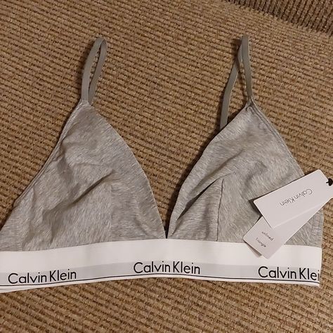 New With Tags Calvin Klein Bra. Size Large. Unlined, Adjustable Straps, Gray With White Logo Band. Back Adjustable Snaps. Excellent Condition. Calvin Klein Underwire, Calvin Klein Bras, Lace Sports Bra, Calvin Klein Ck One, Calvin Klein Bralette, Calvin Klein Bra, Cotton Bralette, White Bralette, Black Bralette