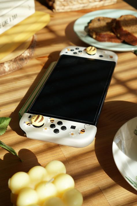 Nintendo Switch Photography, Oled Switch Aesthetic, Nintendo Oled, Switch Cases, Switch Oled Aesthetic, Aesthetic Nintendo Switch, Cozy Nintendo Switch, Nintendo Switch Oled Aesthetic, Nintendo Switch Aesthetic Yellow