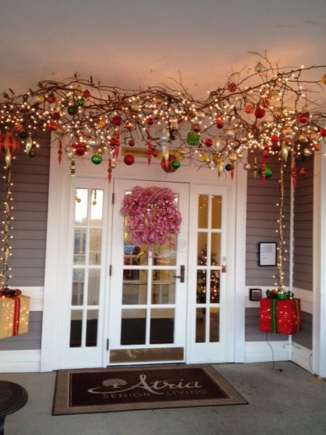 ....branches with lights and ornaments suspended from the ceiling.  This is an outdoor entryway.  (During the fall, pumpkins, etc. were hanging from the branches.) Christmas Ceiling Decorations Ideas, Branches With Lights, Christmas Ceiling Decorations, Christmas Branches, Hanging Christmas Lights, Outdoor Entryway, Hanging Christmas Tree, Christmas Hanging Decorations, Candyland Decorations