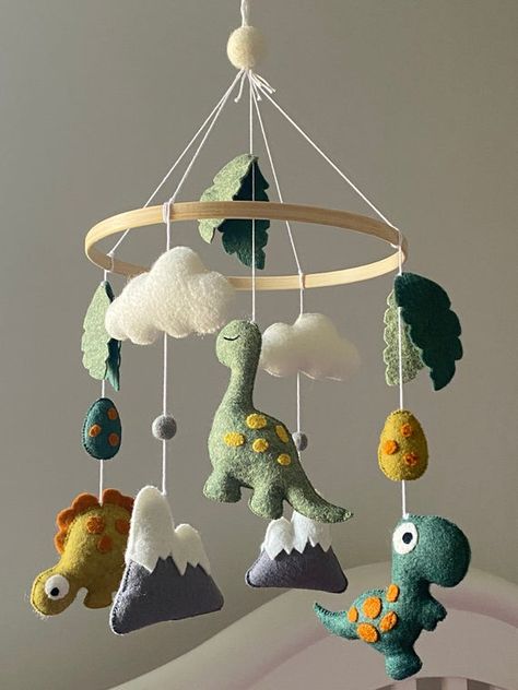 Dinosaur themed baby mobile featuring three different dinosaurs. Baby handmade mobile with felt dinosaur for baby boy or girl nursery. The adorable dinosaur can be a perfect element for your baby nursery. You can put the mobile above a crib, a changing table or a reading corner. Your children will Baby Boy Dinosaur Nursery, Dinosaur Nursery Baby Boy, Baby Mobile Diy, Crib Mobile Boy, Dinosaur Mobile, Dino Nursery, Mobile Ideas, Felt Baby Mobile, Stars Baby Mobile