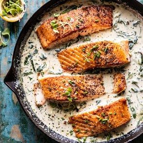 Garlic Butter Creamed Spinach Salmon. - Half Baked Harvest Cold Weather Recipes, Spinach Salmon, Lime Salmon, Cold Weather Food, Healthy Salmon, Spicy Honey, Half Baked, Creamed Spinach, Winter Dinner