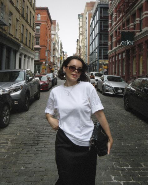 im wearing a skirt ? What is happening to me ? outfit details : tshirt @uniqlousa skirt @zara ballet flats @stevemadden glasses @madewell earrings @asos bag @ysl #summeroutfitideas #summeroutfitinspo #summeroutfits #blacksilk #timelessstyle #blackandwhite #whitetshirt #summerinthecity Oversized white tshirt, black silk skirt, ballet flats, ysl bag, elevated timeless style, silver earrings, summer in the city, oval sunglasses, chic style Skirt Ballet Flats, Madewell Earrings, Black Silk Skirt, Bag Ysl, Summer In The City, Earrings Summer, What Is Happening, Oval Sunglasses, Silk Skirt