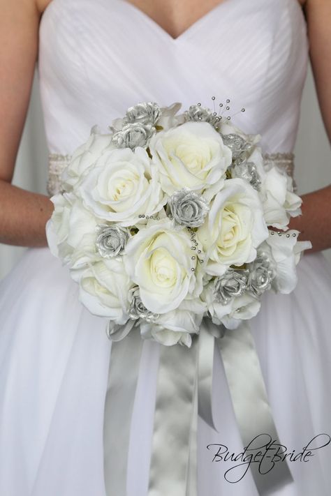 This stunning brides bouquet is round bouquet with ivory and silver roses accented with silver pearls. This bouquet is approx 9 inches wide Bridal Colors, Bride Bouquets White, Davids Bridal Gowns, Gold Wedding Flowers, Red Bouquet Wedding, Budget Bride, Florist Wedding, Beautiful Wedding Flowers, Brides Bouquet