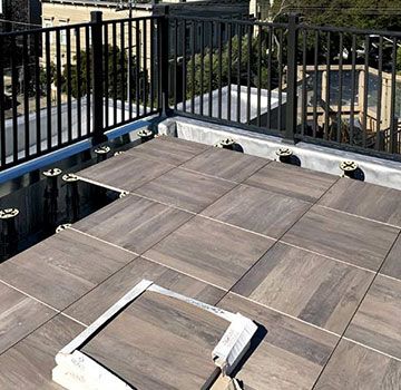 Roof Deck Tiles Ideas - Pros And Cons Of Tile Rooftops, Installing Tips, Best Tile For Rooftop Deck Rooftop Tiles Idea, Tiles For Rooftop, Rooftop Deck Flooring, Rooftop Flooring Ideas, Deck Tiles Ideas, Terrace Flooring Ideas Tile, Roof Pics, Rooftop Tiles, Lizard House