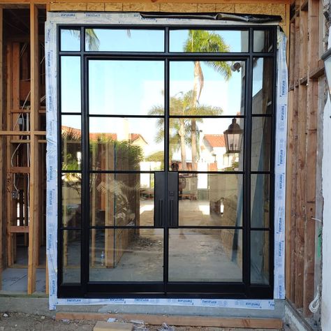 Custom-made french door, with clear glass, angled mullions, sidelights, and transom. The door includes a deadbolt, weather seals, clear glass, pulls. Manufactured by Rhino Steel Windows in North America. Rhino ship doors nationwide in the USA 🇺🇸 and Canada 🇨🇦 . Follow and share if you like more doors and windows ideas. Steel Front Door With Sidelights, Full Glass Entry Door, Steel Glass Doors, House Entry Doors, Hampton Kitchen, Windows Ideas, Steel Entry Doors, Steel Front Door, Gable House