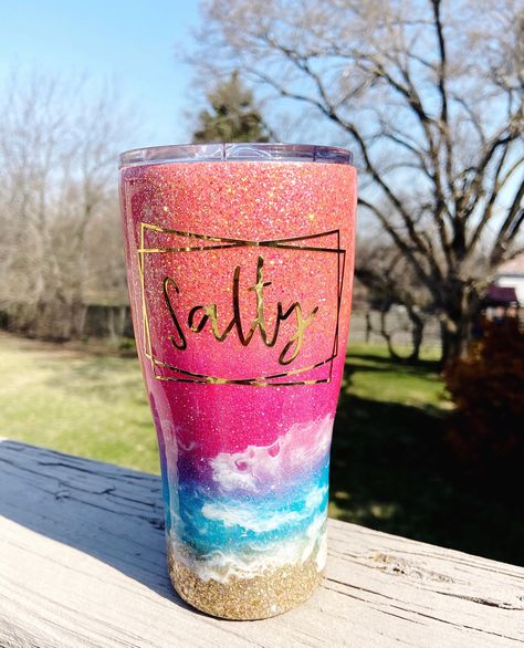 "Please note, \"SALTY\" comes standard on the cup, unless you specify that you do not want the word \"SALTY\" on the cup. Even if you add personalization to your order.  This listing is for a custom sunset beach tumbler. The beautifully blended colors are orange, pink, purple, blue and gold. 20oz modern curve tumbler is shown. Can be completely personalized. Don't like the quote? Please let me know and we can work together to find something that better suits you! My tumblers are coated in FDA ep Sunset Beach Tumbler, Sunset Tumbler, Neon Glitter, Glitter Yeti, Food Safe Epoxy, Pastel Sunset, Ombre Glitter, Glitter Tumbler Cups, Glitter Dipped