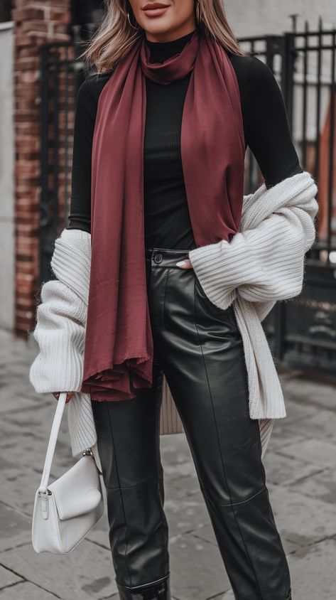 Embrace cozy vibes this fall with this stylishly layered outfit! The classic black turtleneck and wide-leg pants create a sleek base, while the oversized white sweater adds an extra layer of comfort and warmth. A pop of burgundy from the scarf brings a splash of color, making this ensemble perfect for both casual outings and cozy nights in. Perfect for embracing those chillier days! #fallfashiontrends #fallfashion #womanoutfit #outfitideas #autumnoutfitideas Burgundy Turtleneck Outfits, Burgundy Scarf Outfit, Oversized White Sweater, Burgundy Turtleneck, Turtleneck Outfits, Layered Outfit, White Oversized Sweater, Fall Girl, Scarf Outfit