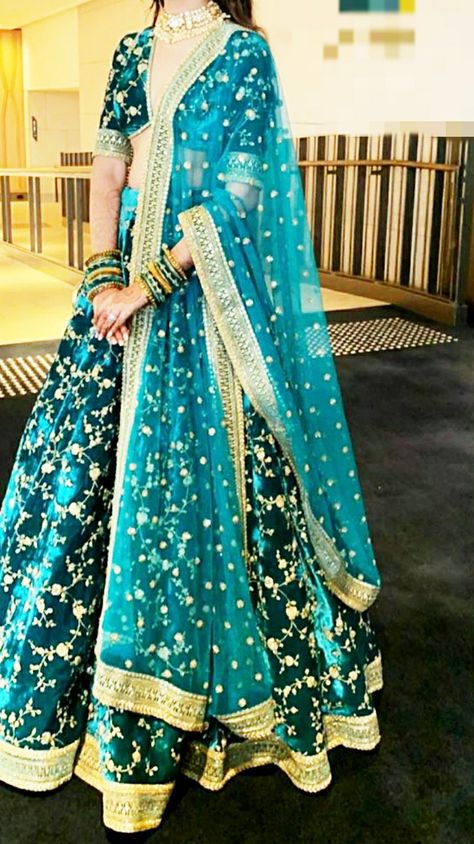 A beautiful unique color teal velvet lehenga by sabyasachi Teal Blue Indian Outfit, Velvet Lehenga Sabyasachi, Velvet Lehenga Simple, Indian Wedding Saree Collection, Lehnga Ideas, Teal Lehenga, Lehenga Sabyasachi, Lehenga Simple, Velvet Bridal Lehenga