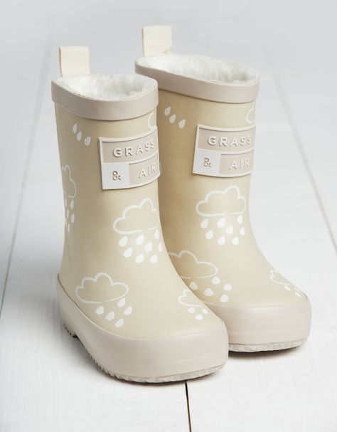 Whether it's forecast to rain or you're taking a trip to the seaside, Grass and Air make the ultimate rainwear for little ones to splash around in. From wellies to umbrellas, there's something extra-special about these pieces when they get wet...Muddy puddles, here we come! These wellies are a staple for rainy days, with a comfortable fleece lining that keeps little feet happy all day long. But the best part? They include a colour-revealing print that transforms from white to multicoloured – try Air Stone, Welly Socks, Stone Colour, Wellies Boots, Kids Fleece, Colour Changing, Holidays With Kids, Kids Boots, Rain Wear