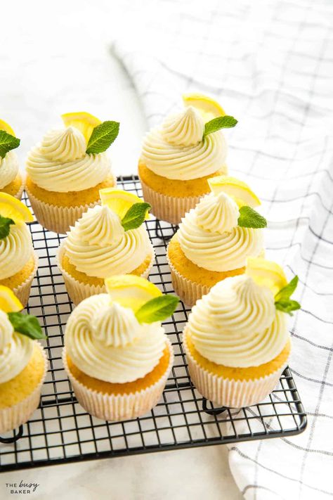 This Lemon Cupcakes Recipe is the perfect light and fresh summer dessert. A tender lemon cupcake with sweet & creamy lemon buttercream frosting. Recipe from thebusybaker.ca! #lemoncupcakes #lemoncupcakesrecipe #lemoncupcakerecipe #easylemoncake #easylemoncupcakes #lemondessert #lemon #easydessert #dessertrecipe Lemon Buttercream Frosting, Lemon Cakes, Lemon Buttercream, White Frosting, Lemon Cupcakes, Pumpkin Recipes Dessert, Cooling Rack, Cooking Classy, Lemon Desserts