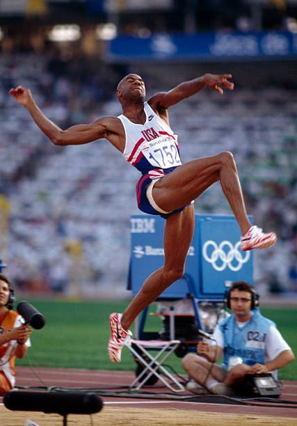 American track and field athlete Mike Powell pictured in action competing for the United States team to finish in second place to win the silver... Olympic Athletes Men, Iv Infusion, Track And Field Athlete, Pro Athletes, Long Jump, Olympic Athletes, Sport Player, Men's Fitness, Athletic Training