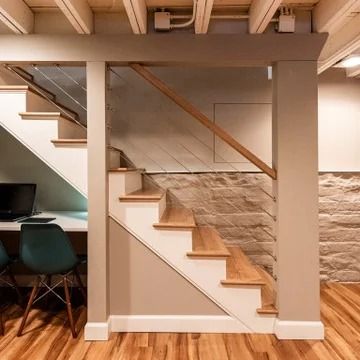 75 Small Basement Ideas You'll Love - March, 2024 | Houzz Oak Stair Treads, Basement Stair Railing Ideas, Small Finished Basements, Small Basement Remodel, Small Basement Ideas, Basement Furniture, Rustic Basement, Basement Layout, Basement Inspiration