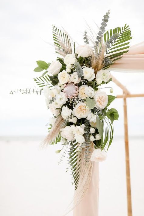 Tropical Beach Inspired Wedding Ceremony Decor, Ivory and Blush Pink Garden Roses, Silver Dollar Eucalyptus, Pink Protea Palm Leaf Floral Bouquet on Bamboo Ceremony Arch | Clearwater Beach Photographer Lifelong Photography Studios Beach Inspired Wedding, Pink Protea, Clearwater Beach Wedding, Florida Destination Wedding, Beach Wedding Decorations Reception, Dollar Eucalyptus, Tropical Wedding Flowers, Beach Wedding Reception, Beach Wedding Flowers