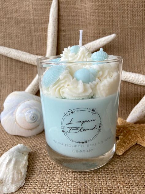 Our curated artisnal scented candles not only smell amazing but bring a bit of seaside whimsy with sculpted shells and fish. The Seaside scent: Top notes: Mandarin, Cardamom, Middle: Black pepper, Jasmine, Base: Sandlewood, Patchouli Don't you need an escape? Beach Candles Diy, Homemade Candle Wax, Ocean Candle, Sea Candles, Handmade Candles Diy, Sea Gulls, Take Me To The Beach, Diy Candles Homemade, Homemade Scented Candles