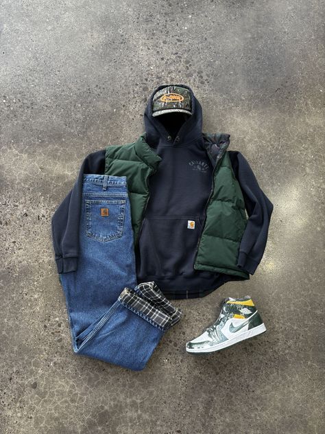 Carhartt flannel lined denim pants Eddie Bauer green vest camo snapback hat carhartt hoodie Air Jordan Nike Mids green outfit blue outfit ootd outfit details sneaker outfits fall outfits auatumn outfits autumn style layering outfit autumn fashion layered outit layer fashion denim jeans vintage denim vintage clothing retro clothing fall fashion fall style fall wear autumn outfits workwear work wear style street style inspo streetwear street outfits street fashion retro look oversized fashion Green Carhartt Jacket Outfit, Nike Mids, Carhartt Vest Outfit, Green Carhartt Jacket, Carhartt Jacket Outfit, Carhartt Outfit, Sneaker Outfit Fall, Layer Fashion, Carhartt Flannel