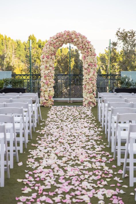 Aisle Arch Wedding, Rose Petal Wedding Aisle, Pink And White Aisle Flowers, Flower Petal Lined Wedding Aisle, Aisle Arch, Aisle Lined With Petals, Rose Petal Lined Wedding Aisle, Outside Wedding Ceremonies, Rooftop Wedding Ceremony