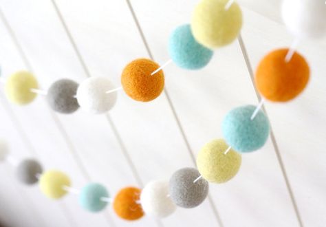 This felt ball pom pom garland features the following colors: Robins Egg Blue Orange Lemon Yellow Warm Gray White I call it, Bright Sunshiney Day. The bright pops of yellow and orange and Robins Egg Blue would be the perfect addition to a boy nursery decor, or gender neutral nursery, Woodland Bedroom Ideas, Nursery Travel Theme, Unisex Nursery Decor, Gold Nursery Decor, Woodland Bedroom, Nursery Garland, Mint Nursery, Colorful Nursery, Nursery Bunting