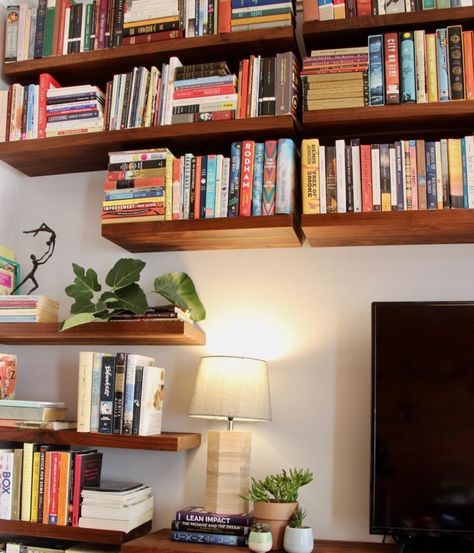 Hanging Bookshelves Living Room, Floating Bookshelves Around Tv, Diy Wall Shelves For Books, Bookshelves Under Tv, Floating Wall Bookshelves, Bookshelves Tv Wall, Bookshelves In Dining Room, Floating Bookshelves Living Room, Bookshelves Around Tv