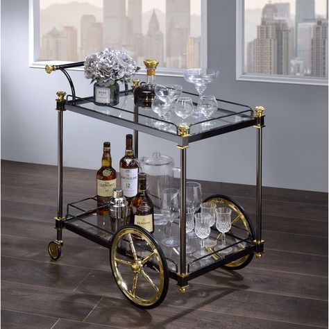 Serve meals fashionably with this lovely Bar Cart. It pairs perfectly with clear tempered glass for a look of refined sophistication. Two tiers easily accommodate trays and entrees, while wheels and a metal handle make it simple to move this dainty design from one place to the next. Dining Room Bar Cart, Bar Mobile, Metal Bar Cart, Rolling Bar Cart, Vintage Bar Carts, Bar Cart Styling, Bar Scene, Cart Decor, Bar Storage