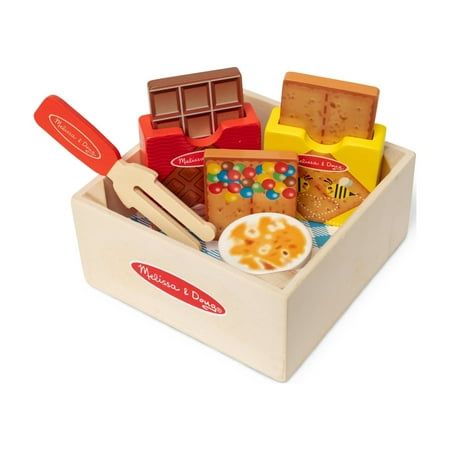 Great for pretend picnics or play kitchens and restaurants, this sturdy wooden crate is filled with wooden play food for making a deliciously imaginative dessert! Stack the pieces to create a yummy pretend play s'mores treat. Pieces include wooden marshmallow that fits on a roasting stick, 2 graham crackers in a box, and a chocolate bar in a box. Mix and match with other Melissa & Doug Picnic Box Play Sets! Size: 2.350"L x 5.200"W x 5.200"H.  Color: Multicolor. Ice Creamery, Wooden Play Food, Picnic Box, Play Food Set, Play Kitchens, Wooden Food, Summer Preschool, Play Sets, Melissa And Doug