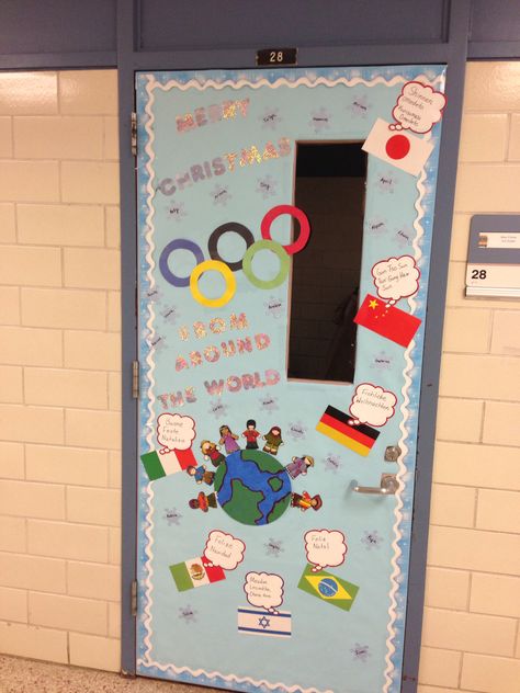 Olympic themed Christmas door. Merry Christmas from around the world. Holiday Around The World Door Decoration, Holidays Around The World Door Decor, Holidays Around The World Door Decorating Contest, Christmas Around The World Classroom Door, Around The World Classroom Door, Christmas Around The World Door Decor, Nursery Teaching Ideas, Christmas Around The World Italy, Spanish Classroom Door