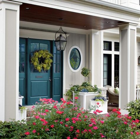 Teal Front Door Colors | pale gray and white trim, an intense shade of teal on the front door ... Teal Front Door Colors, Teal Front Door, Teal Front Doors, Teal Door, Pintu Interior, Exterior Door Colors, Tan House, Bold Paint Colors, Blue Front Door