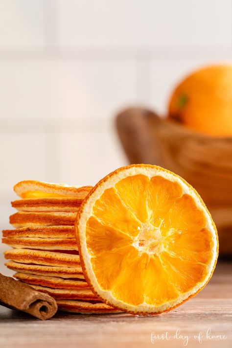 Learn how to make beautiful dried orange slices to use as home decorating accents or culinary garnishes. Find out which drying method is best for you, and see examples of different orange varieties. #driedoranges #orangeslices #firstdayofhome Dried Orange Drink Garnish, Dry Oranges In Air Fryer, Dried Orange Slices In Oven, Dry Out Orange Slices, Dry Oranges In Oven, How Do You Dry Orange Slices, Dried Mandarin Orange Slices, Oven Dried Orange Slices, How To Dry Orange Slices In The Oven