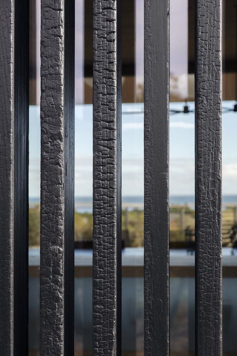 Outdoor, Vertical Fences, Wall, and Wood Fences, Wall The shou-sugi ban louvers were designed and made by Schiller.  Photo 9 of 19 in A Student and Teacher Team Up on a Multi-Generational Martha’s Vineyard Abode Wood Cladding Exterior, Casa Wabi, Wood Fences, Modern Outdoor Spaces, Natural Fence, Sauna Design, Sugi Ban, Shou Sugi Ban, Teacher Team