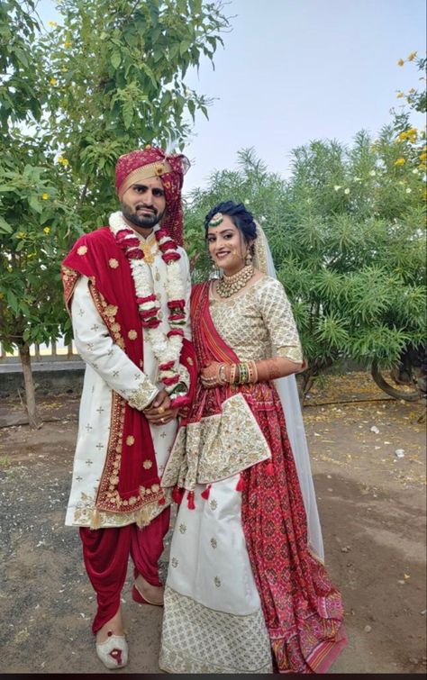 A couple’s wedding outfit is one of the most important aspects of the big day.Consider having your outfits custom made to ensure they fit perfectly and match your vision. Remember, your wedding outfit is a reflection of your personalities, so have fun with it and make it unique to you. #lehenga #couplegoals #weddingcouple #weddinginspiration #lehnga #lehengacholi #bridetobe #brideandgroom #grrom #groomtobe #designercoupledressesforweddding #weddingvibes Groom And Bride Outfit, Off White Lehenga, Gujarati Bride, Groom And Bride, White Lehenga, Outfit Wedding, Bride Clothes, Couple Outfits, Lehenga Choli