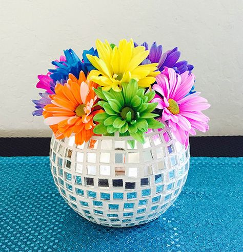 13 DIY Disco Ball Inspired Projects for the True Dancing Queen 70s Centerpiece Ideas Diy, 60s Party Centerpieces, One Year Old Disco Party, 70s Decor Party, 70s Disco Party Decorations Table Centerpieces, 60s Centerpiece Ideas, 70s Theme Centerpiece Ideas, 70s Table Decor, 70s Party Decorations Ideas