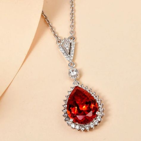 12.283ct fiery padparadscha red orange sapphire set with 53 zircon gemstones Orange Sapphire Jewelry, Diamond Jewelry Aesthetic, Orange Diamond, Jewelry Aesthetic, Padparadscha Sapphire, Orange Sapphire, Sapphire Necklace, Sapphire Jewelry, Shoot Ideas