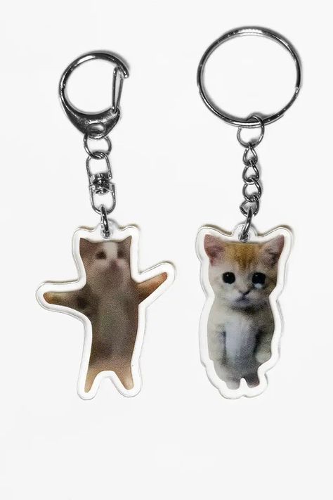 Limited Edition TikTok trend meme Y2K double sided acrylic Happy Cat and El Gato Cat keychains! Get the Limited Edition Banana Keychain from the TikTok memes! This about 4 x 3 CM keychain is double sided easy to carry around and clip on to your bag. – Double sided: Print encased in high quality acrylic.– Limited Stock: Don't miss out, it's a must have collector's item.– Trendy: As seen on your TikTok fyp and silly (banana) cat meme trends.– Easy to Carry: Clip it to your keys or bag.– Size: Perfect for on your keychain, phone or bag! (About 4 x 3 CM) Shop more (banana) cat meme keychains here. Silly Keychain, Banana Keychain, Keychain Y2k, Pin Keychain, Banana Cat, Keychain Phone, Tiktok Memes, Silly Gifts, Gato Cat