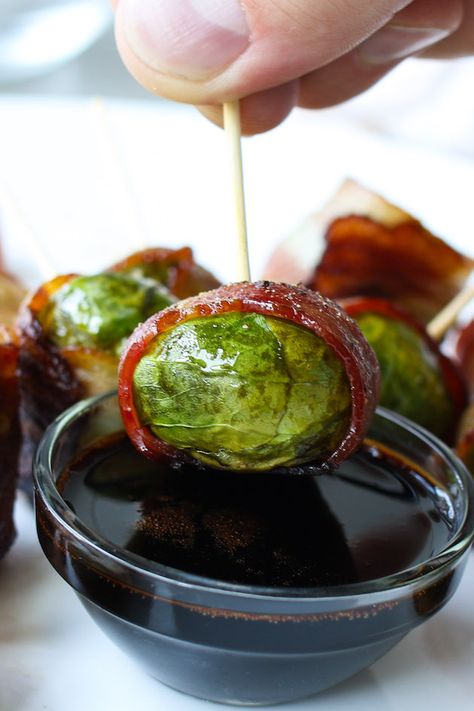 A bacon wrapped brussel sprouts being dipped into a balsamic dressing for the perfect hors d'oeuvre Bacon Wrapped Brussel Sprouts, Radish Recipes, Bacon Brussel Sprouts, Elegant Appetizers, Cayenne Pepper, Bacon Wrapped, Brussels Sprouts, Holidays Christmas, Cayenne