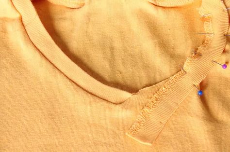 Step-by-Step Tutorial for Turning a Crew Neck T-Shirt Into a V-Neck | ehow T Shirt Refashion, Umgestaltete Shirts, Altered T Shirts, Shirt Makeover, Fabric Shears, Recycled Clothes, Cut Off Shirt, Swiss Miss, Sewing Alterations