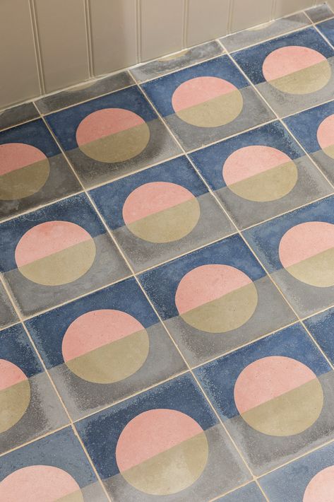 Charlotte Bucciero Interiors | A statement floor can make a significant impact as you enter a room, especially when using patterned cement floor tiles. This is a fantastic way to introduce colour to a bathroom or hallway while keeping the walls light and neutral. We love the colour palette and simple geometries of these cement tiles used in a downstairs cloakroom. Paired with soft white panelling, they bring charm and character to the small space, making it feel more inviting. Cement Floor Tiles, Ensuite Bathroom Designs, Spatial Planning, Dining Corner, Downstairs Cloakroom, Hallway Colours, Wooden Panelling, Study Room Design, Cement Floor