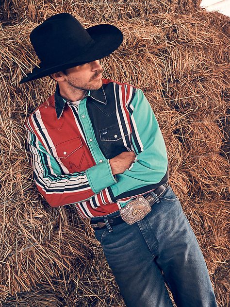 Classic style with a modern edge. Our Vintage-Inspired Brushpopper Western Snap Work Shirt will take any outfit up a notch. It’s crafted from cotton for comfort in any season, and it comes with a 90’s-inspired design full of bold, colorful stripes. The placement of the stripes as well as the vintage fading on the shirt is unique so no two shirts are alike. It comes with all the iconic details you know and want, including the pointed yokes from front to back, the chest pockets with our signature “W” stitching, and pearl snaps. Plus, its regular fit isn’t too tight or too loose. Wrangler Vintage, Short Uggs, Western Boots For Men, Western Store, Wrangler Shirts, Work Boots Men, Cowgirl Western, Jumpsuit Jacket, Men's Shirts