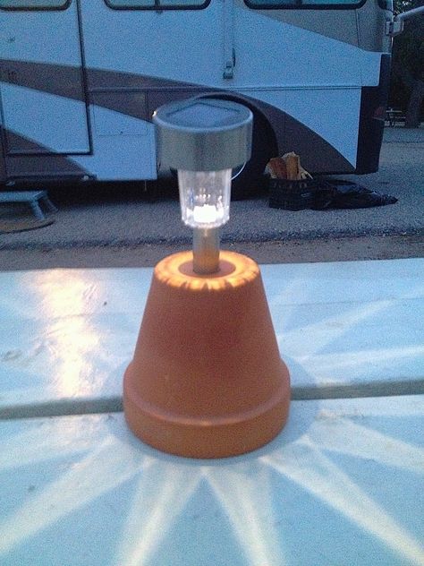 Bring a few solar lights from home and mount them on terra cotta planters to make easy camping lanterns. Camping Tricks, Travel Vans, Zelt Camping, Camping Diy, Lighted Centerpieces, Camping Checklist, Diy Camping, Camping Glamping, Beautiful Plants