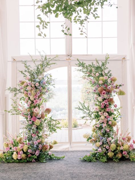 Ceremony Flowers Aisle Entrance, Art Gallery Wedding Decorations, All Pink Wedding Flowers, Deconstructed Flower Arch, Pastel Wedding Arch Flowers, Sage Green Wedding With Colorful Flowers, Floral Arch Wedding Indoor, Pink Garden Party Wedding, Church Ceremony Flowers