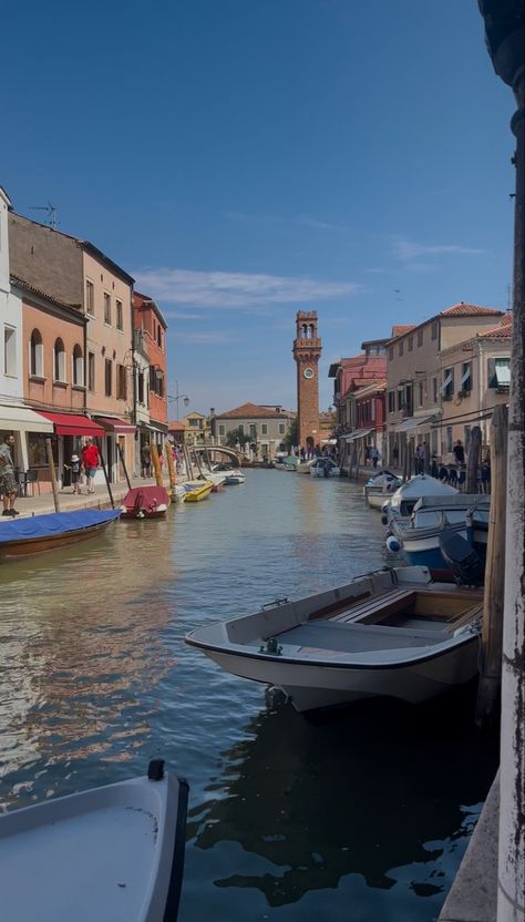 The island of Murano, famous for its traditional glass-making. #murano #venice #italy #muranoglass #glass #mornings #canals #water #boat #tower #clocktower Murano Venice, Water Boat, Glass Making, Murano Italy, Italy Photography, Red Bag, Clock Tower, Venice Italy, Pretty Places