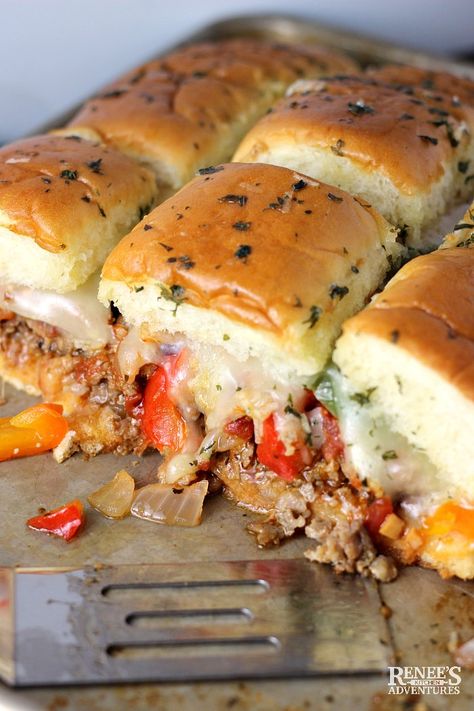 Sausage and Peppers Hawaiian Roll Sliders created by Renee's Kitchen Adventures - easy pull apart slider recipe made with Hawaiian rolls, Italian sausage, peppers, onions, and cheese baked in the oven and served warm. Great game day food, football food, or anytime snack or appetizer. Great for crowds. #GameDayfood #Footballfood #tailgating #sliders #Hawaiianrollsliders Italian Sausage Sliders, Sausage Sliders, Sliders Recipes Hawaiian Rolls, Roll Sliders, Slider Recipe, Hawaiian Roll Sliders, Sausage Peppers And Onions, Hawaiian Roll, Italian Sausage Recipes