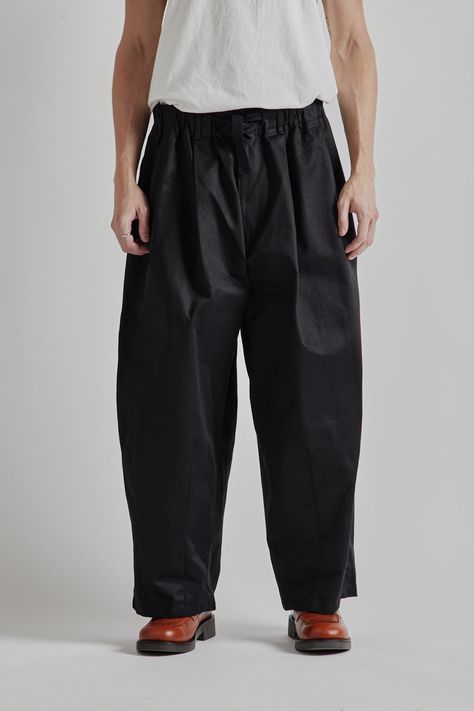 is-ness Balloon EZ Pants - Black These Balloon EZ Pants are a signature piece, featuring a voluminous silhouette that offers comfort and a unique form. The design tapers gradually from the knees down, creating a distinctive shape. Perfect for those seeking a relaxed yet stylish fit, these pants combine ease of wear with a bold, contemporary look. Balloon Pants, Pants Black, Mens Trousers, Black Pants, Balloons, Trousers, Pants, How To Wear, Clothes Design