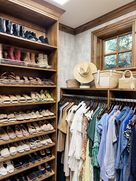 Two images of a women's primary closet with a floor to ceiling shoe wall and organized shelves of shoes. There is a clear stool to access the shoe wall. There are dresses hanging organized by color on the opposite wall, and a display ledge above the dresses with handbags and hats. Primary Closet, Gorgeous Closet, Organizers Storage, Shoe Wall, Hat Stands, Drawer Organizers, How To Make Shoes, Closet Organization, Step Stool