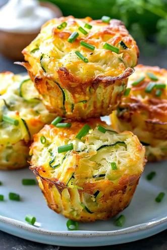 Crispy Parmesan Zucchini Potato Muffins are a perfect blend of cheesy, crispy, and savory flavors. These easy-to-make muffins are packed with zucchini and potatoes, making them a healthy snack or side dish option that the whole family will love. Ready in just 40 minutes, they’re ideal for meal prep or an on-the-go treat. Save this recipe and try it today for a crispy, flavorful bite that’ll keep you coming back for more! Potato Muffins Recipe, Parmesan Zucchini Bites, Zucchini And Potatoes, Zucchini Bites, Potato Muffins, Parmesan Potatoes, Parmesan Zucchini, Light Snacks, Onion Recipes