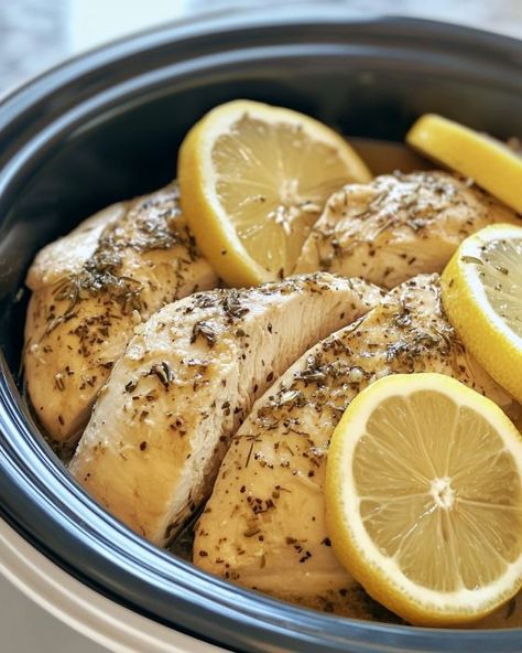 'Lemon Herb Comfort'—just 4 ingredients and your house smells amazing! Perfect for a cozy winter dinner. Slow Cooker Lemon Herb Chicken, Lemon Crockpot Chicken, Lemon Chicken Crockpot, Crockpot Lemon Chicken, Lemon Herb Chicken Breast, Cozy Winter Dinner, Slow Cooker Lemon Chicken, Lemon Herb Chicken, Crockpot Dinners