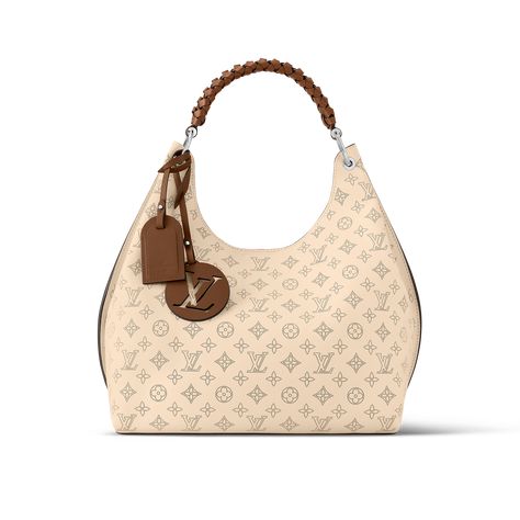 The Carmel hobo bag is a spacious, lightweight style in Mahina calf leather with Monogram perforations. The supple leather and the soft form of the bag combine to make it exceptionally pleasant to carry. Craft details such as the braided handle and LV leather charm add to the sophistication of this model. Louis Vuitton Hobo Bag, Louis Vuitton Hobo, Luxe Handbags, Louis Vuitton Satchel, Louis Bag, Sac Louis Vuitton, Louis Vuitton Gifts, Louis Vuitton Monogram Bag, Louis Vuitton Limited Edition